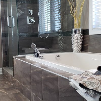 Luxurious modern interior bathroom detailed with rich brown color tiles flooring and walls,