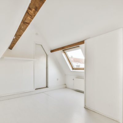 Room with windows and parquet floor